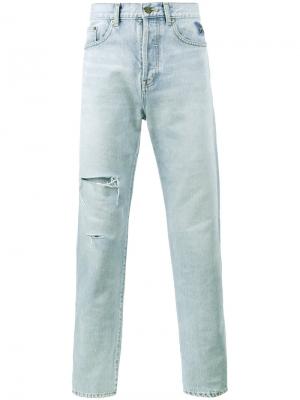 Выцветшие джинсы с рваными деталями Saint Laurent. Цвет: синий