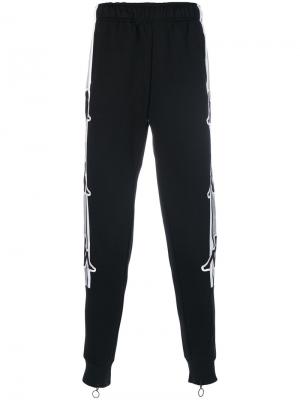 Спортивные брюки с полосками по бокам Kappa. Цвет: чёрный