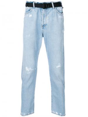 Зауженные к низу джинсы с эффектом потертости Off-White. Цвет: синий