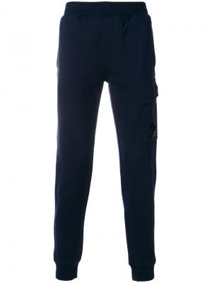 Зауженные спортивные брюки CP Company. Цвет: синий