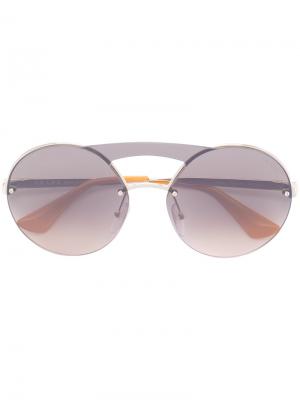 Солнцезащитные очки в круглой оправе Prada Eyewear. Цвет: металлический