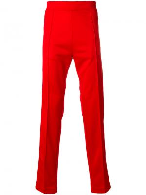Спортивные брюки с полосками Maison Margiela. Цвет: красный