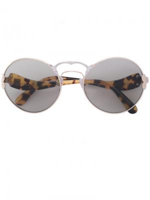 Солнцезащитные очки в круглой оправе Prada Eyewear. Цвет: коричневый
